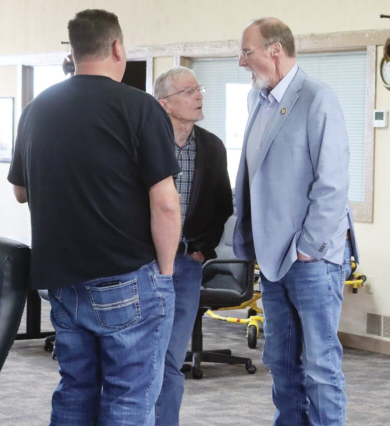 State Representative Marty Long speaks with constituents following the final Legislative Coffee of the year.