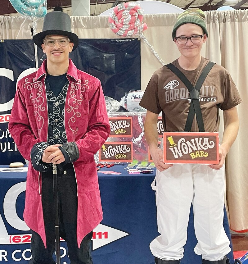 Julian Rosales, left, dressed up as Willy Wonka and Ty Straub was an Oompa Loompa at the ACC booth Friday night during the 2025 Spring Fling. Shawn Yorks/The Ulysses News