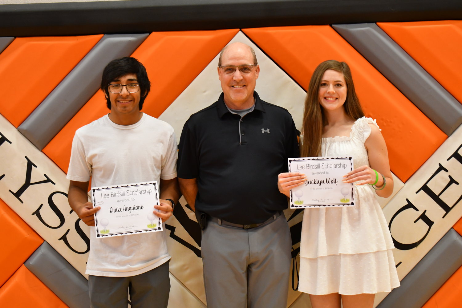Senior Awards — Drake Anguiano and Jacklynn Wolf were given the Lee Birdsill Memorial Scholarship by Travis McAtee on Friday, May 13, 2022.