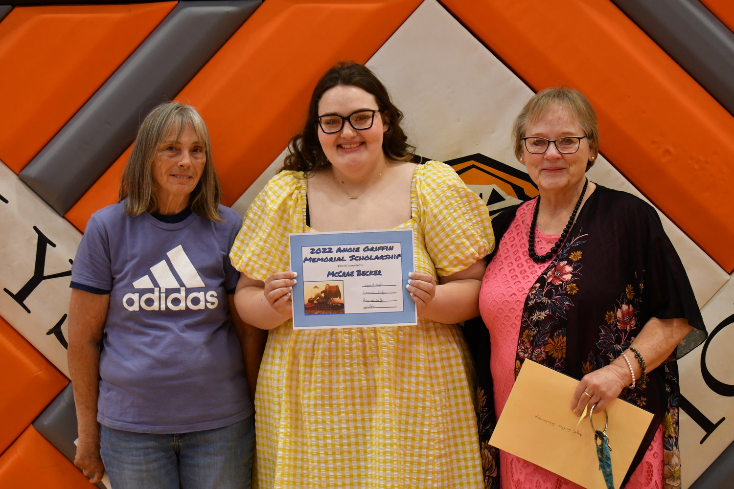 Senior Awards — McCrae Becker was given the Angie Friffin Award by Connie Griffin and Tamra Rundell on Friday, May 13, 2022.