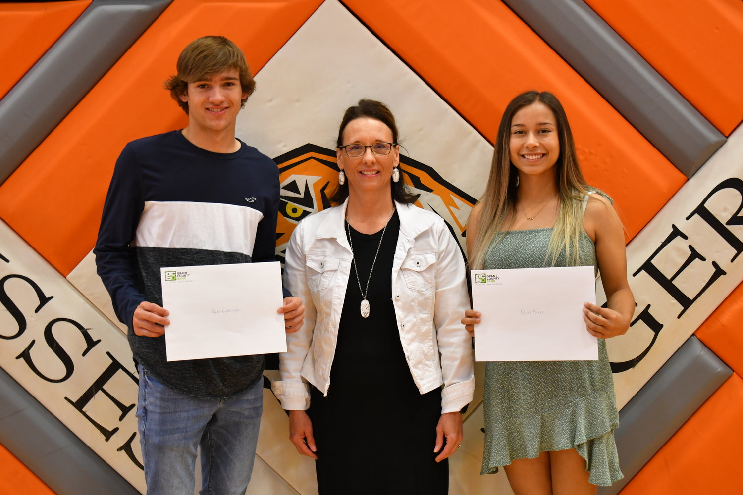 Senior Awards — Ryan Nightengale and Laura Porras were given the Big Orange Boosters Scholarship by Margaret Nightengale on Friday, May 13, 2022.