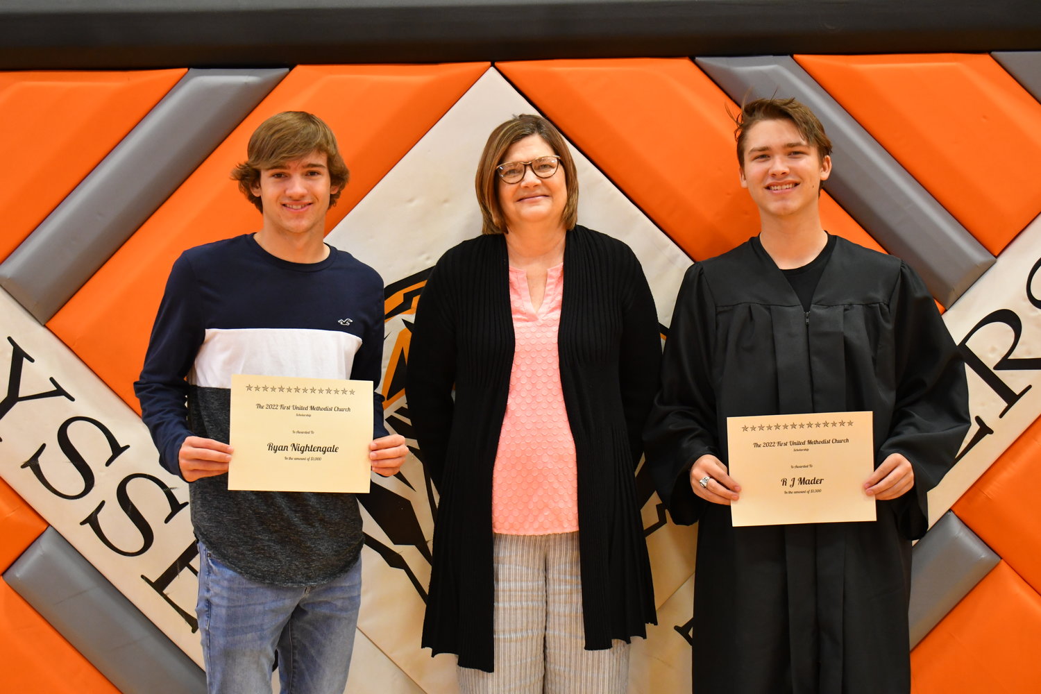 Senior Awards — Ryan Nightengale and R.J. Mader were given the First United Methodist Church Scholarship by Katrina Benysheck on Friday, May 13, 2022.