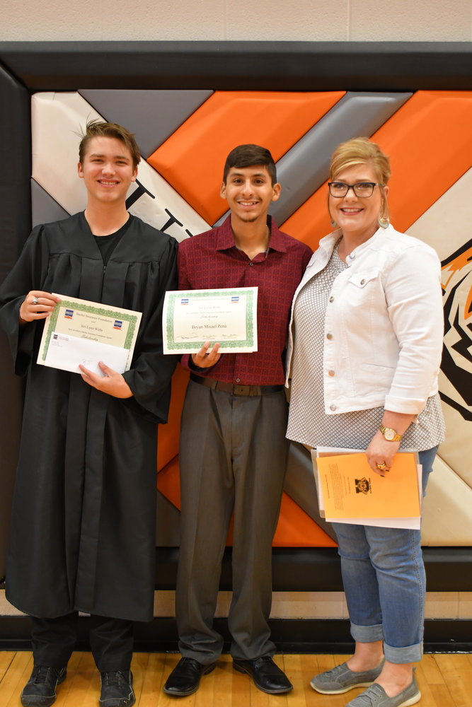 Senior Awards — R.J. Mader and Bryan Peña were given the Shelter Insurance Scholarship by Jerri Lynn Wells on Friday, May 13, 2022.