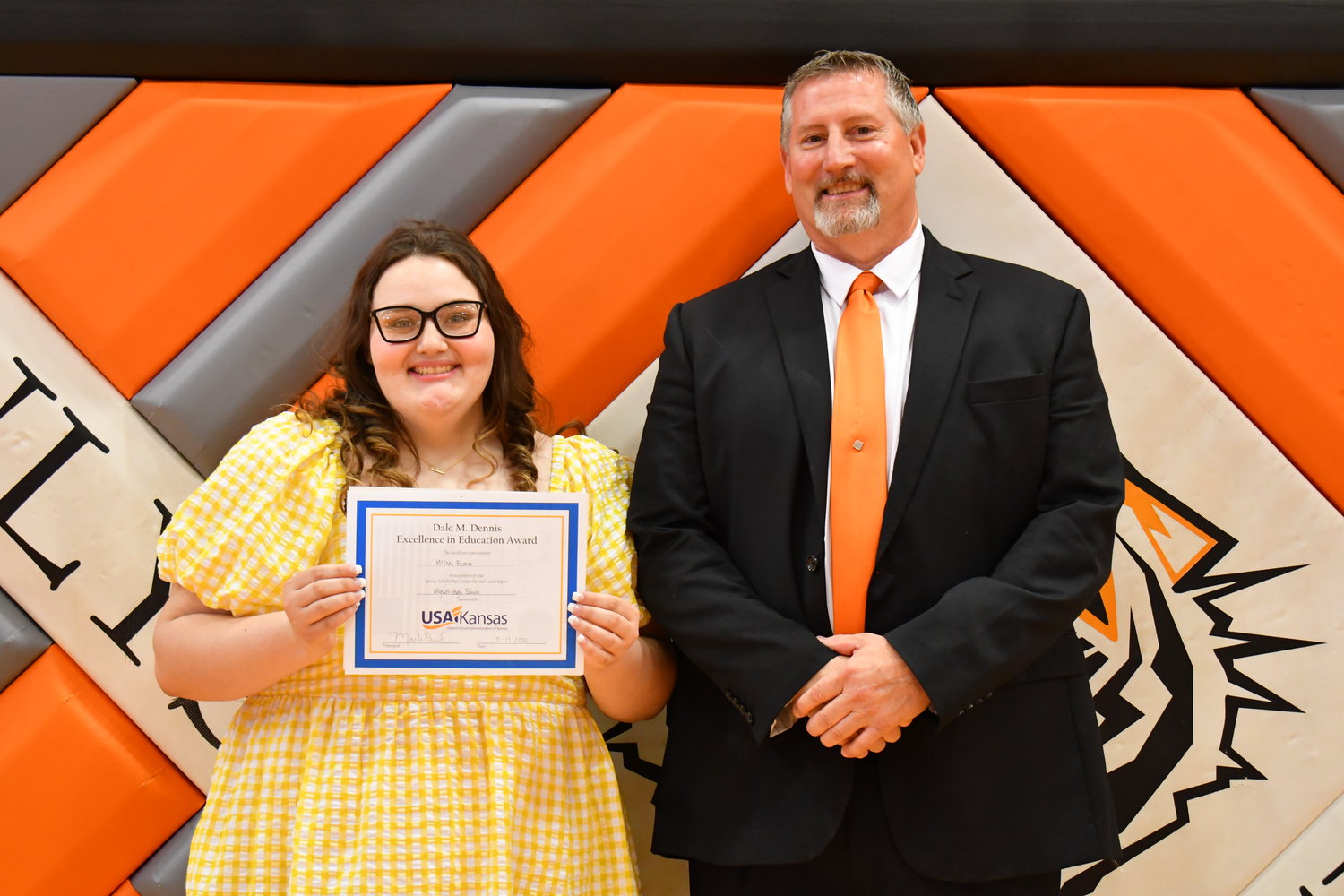 Senior Awards — McCrae Becker was given the Dale M. Dennis Excellence in Education Award from Mark Paul on Friday, May 13, 2022.