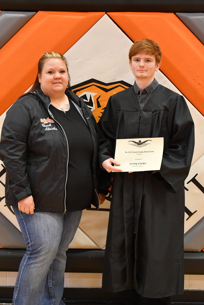 Senior Awards — Robbie Carter was given the Sharks Swim Team Scholarship from Aleisha Stepp on Friday, May 13, 2022.