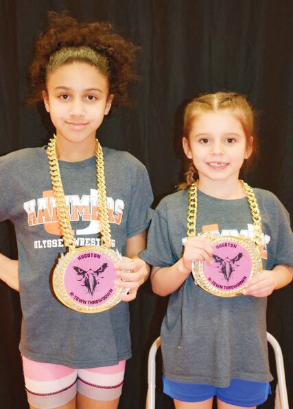 Melody Johnson, left, and Averie Cortez of the U-Town Hammers wrestling club took first place at the H-Town Throwdown tournament in Hugoton on Feb. 22. Melody and Averie were also awarded the outstanding wrestler award.