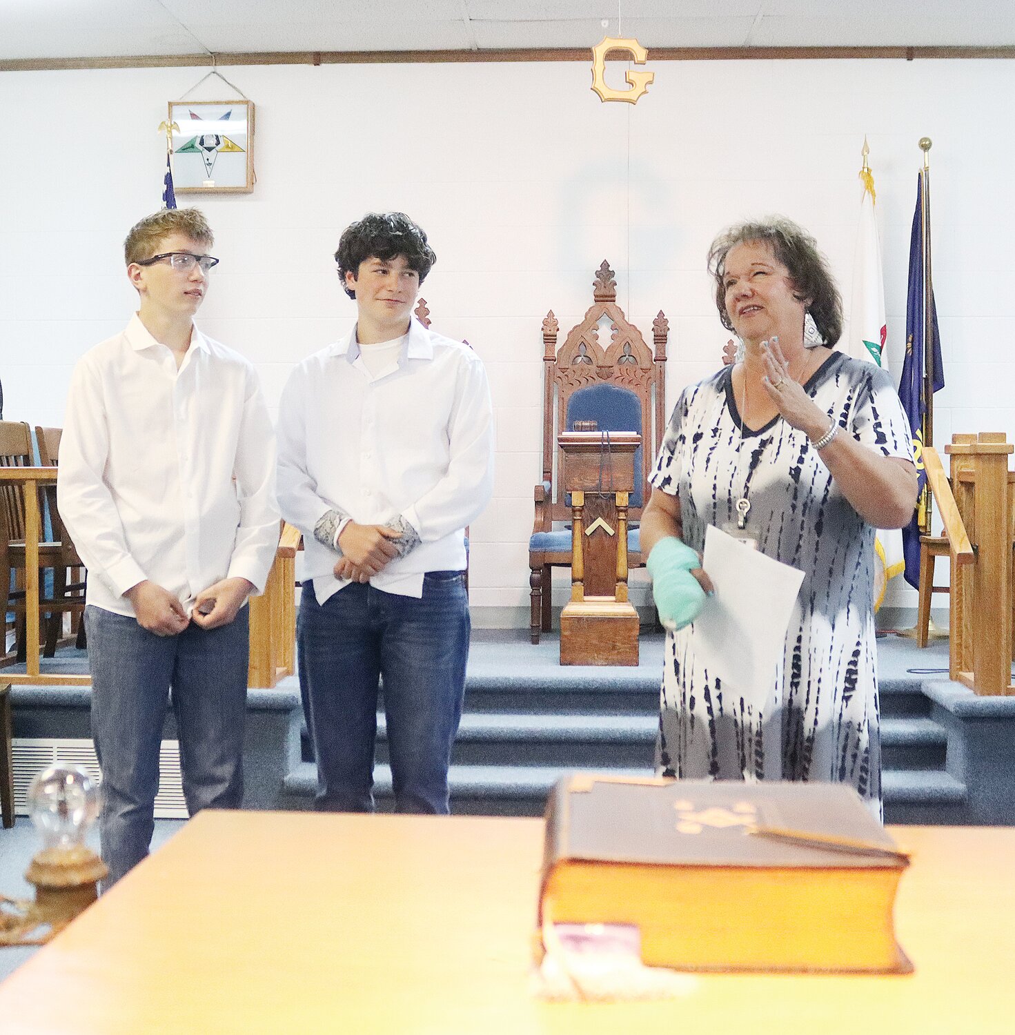 Kepley Middle School science teacher Kim Sandoval, right, speaks during last Friday’s Chamber Coffee at the Ulysses Masonic Lodge as seventh graders Aubrey Hegwood and Bain Anderson look on. The Anderson-Hegwood "Wind Warriors" team competed in the Kansas KidWind Challenge April 5 in Salina and qualified for the national competition May 18-21 in Phoenix, Ariz.