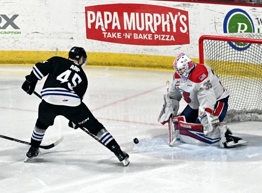 Wenatchee Wild forward Steven Arp tosses a shot toward the Spokane Chiefs’ net Tuesday in a 6-4 loss in Western Hockey League play. Arp was one of 11 Wild skaters to finish with at least one point.