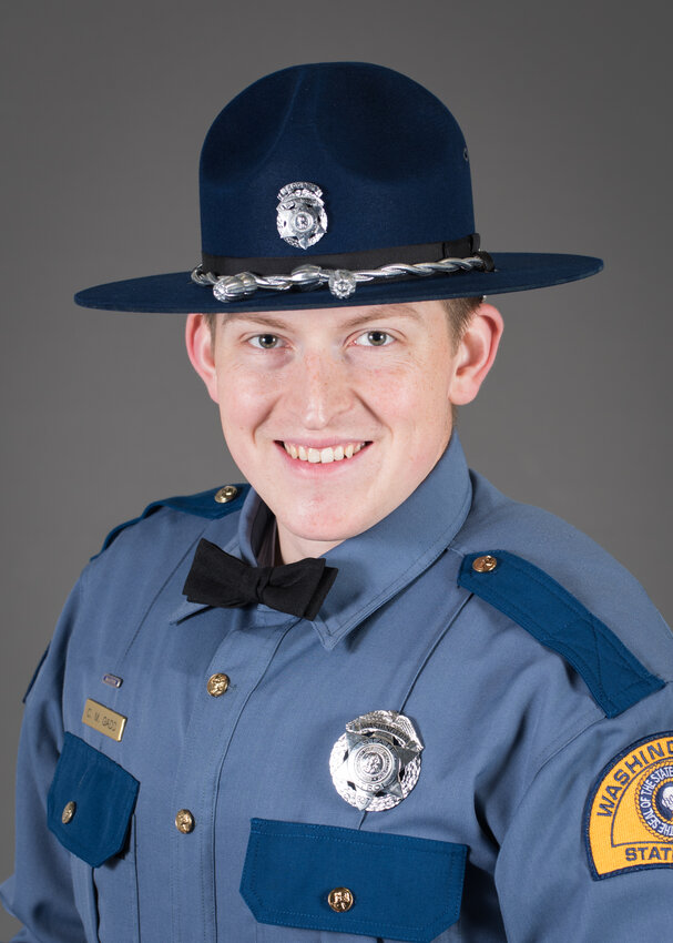 Trooper Christopher M. Gadd, remembered for his service and sacrifice, poses in uniform. Gadd, who joined the Washington State Patrol in 2021 and was recognized for his academic excellence during training, tragically lost his life in the line of duty on Interstate 5 in Marysville. He is survived by his family, including his wife Cammryn, daughter Kaelyn, and a legacy of dedication to public service.