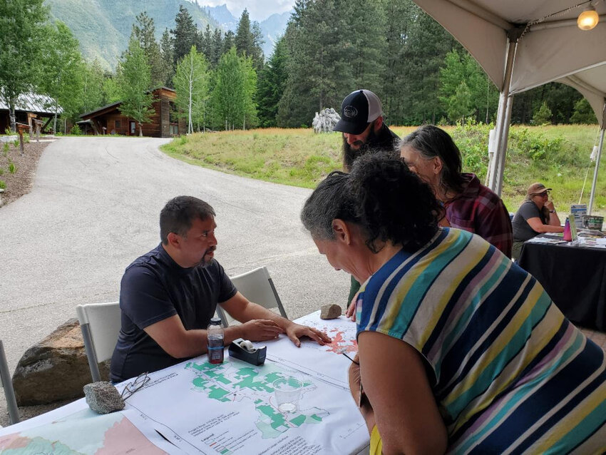 Forest Service Fuels Planner, Mike Barajas, answers questions from citizens about planned prescribed fire and fuels reduction work on the Wenatchee River Ranger District at the 2023 Wildfire Prevention Community Workshop hosted by the Chumstick Wildfire Prevention Coalition on May 23, 2023.