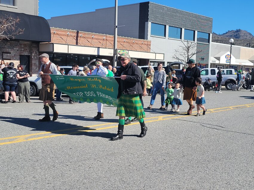 Leading the Wayne Kelly Memorial St. Patty’s Top Dog Parade was Pat Kelly (on the left) holding the banner for the parade which honors his father, Wayne Kelly.