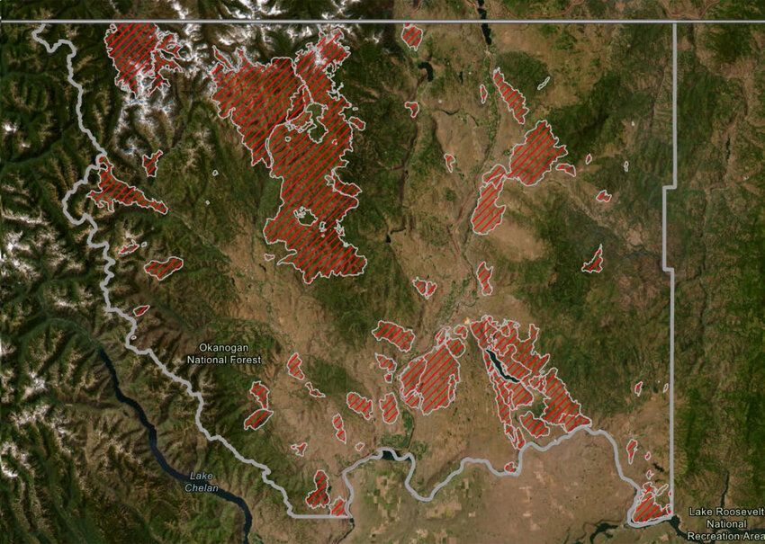 This map shows wildfire activity (red) in Okanogan County between 1988 and 2023.