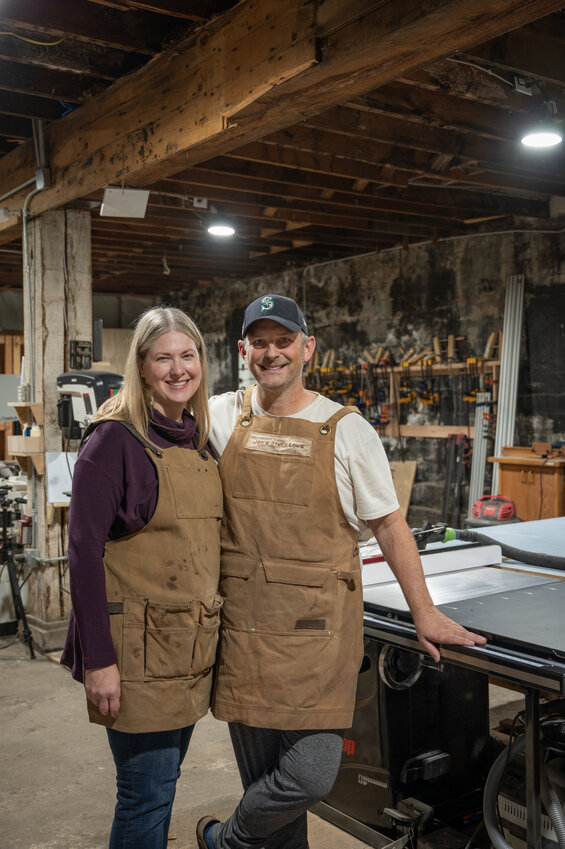 NCW Woodshop owner Jonathan Clark and wife Jennifer Moraski pose inside their Cashmere shop.
