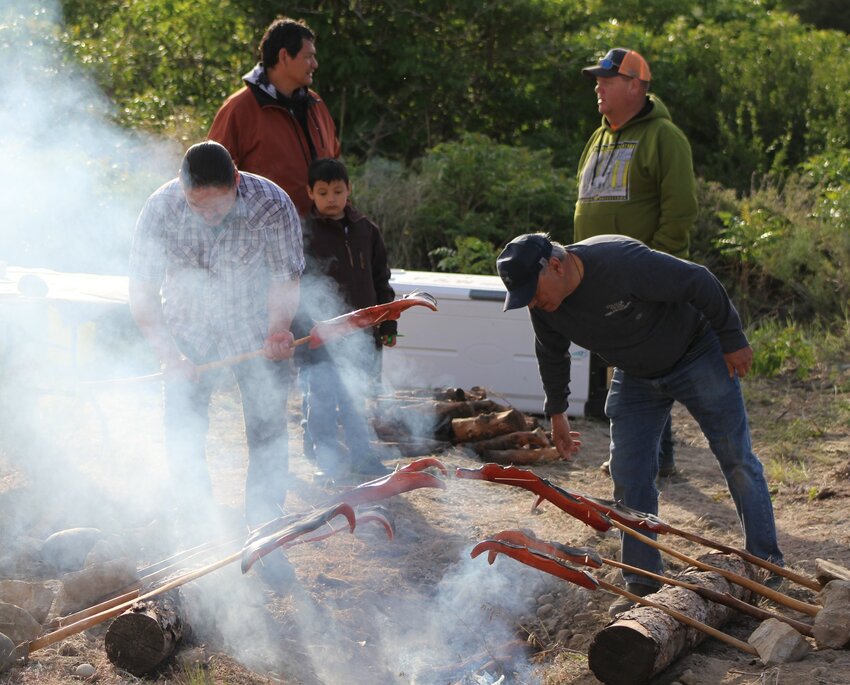 Salmon cooked on skewers over a hand-dug barbecue pit, the traditional tribal way, will be the featured dish at the CCT First Salmon Ceremony on May 23.