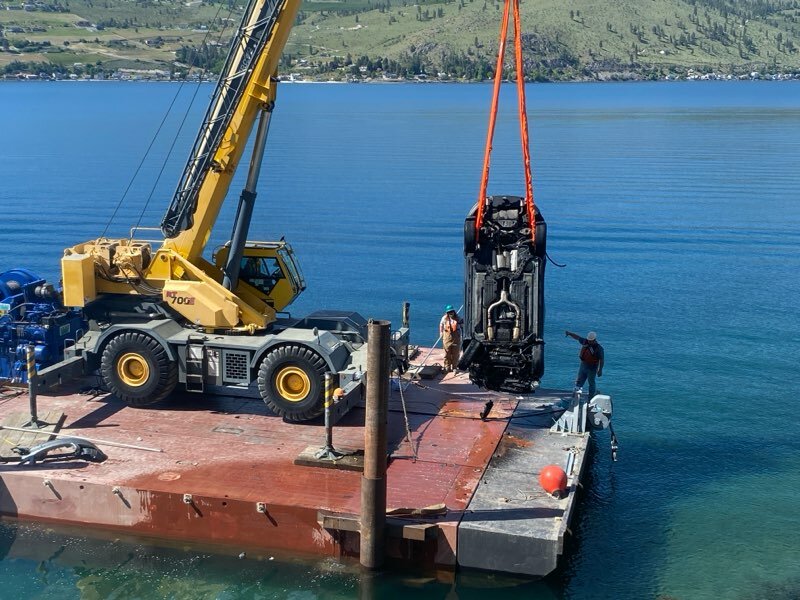 Workers use a barge and crane to retrieve a vehicle from Lake Chelan after a Colville man crashed his SUV into the lake Monday evening. Manson and Chelan Fire Departments worked to free the man and were able to start CPR before he was Life-Flighted to Harborview Medical Center. The man is expected to survive.