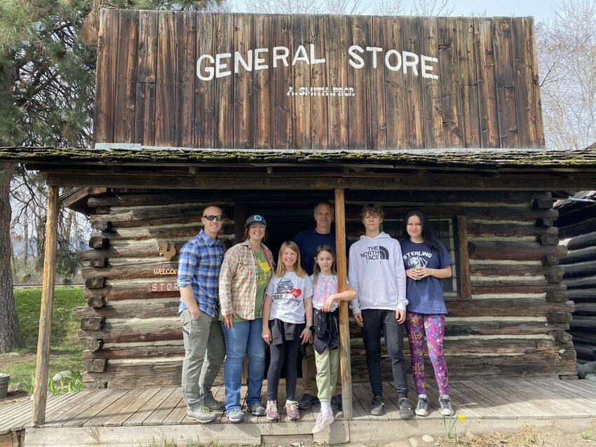 Coleen Malmassari, her husband, daughter, her third cousin Brian Smith and his children work to maintain the General Store cabin during the Spring Clean Up in 2022. Malmassari and Smith, descendants of the original owner Archie Smith, have co-adopted the cabin for clean up.
