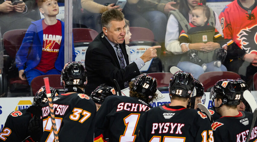 Don Nachbaur instructs his team on the Calgary Wranglers’ bench during a 2023-24 game. The Wenatchee Wild of the Western Hockey League announced Thursday that Nachbaur had signed to become the team’s new head coach.