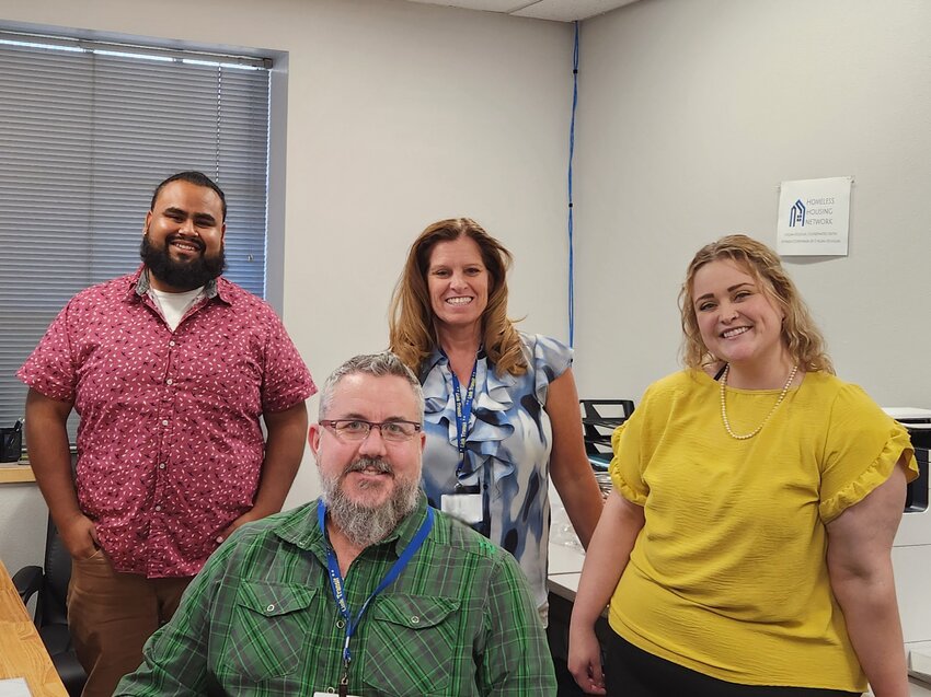The Homeless Housing Network Team (from left to right) Juan, Jon, Angela, and Amber take a brief moment of respite from their crucial work to pose for the camera.