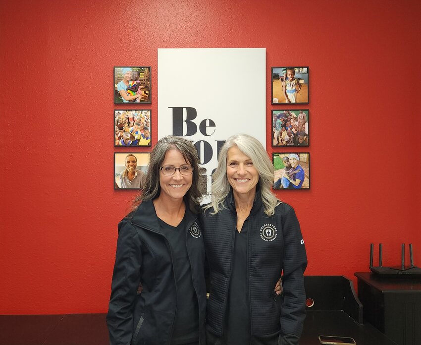 Brandi Darnell (left) and Marian Leone-Lambert (right) stand in their Sole Sisters office, ready to provide simple and easy thermal imaging services with smiles on their faces.