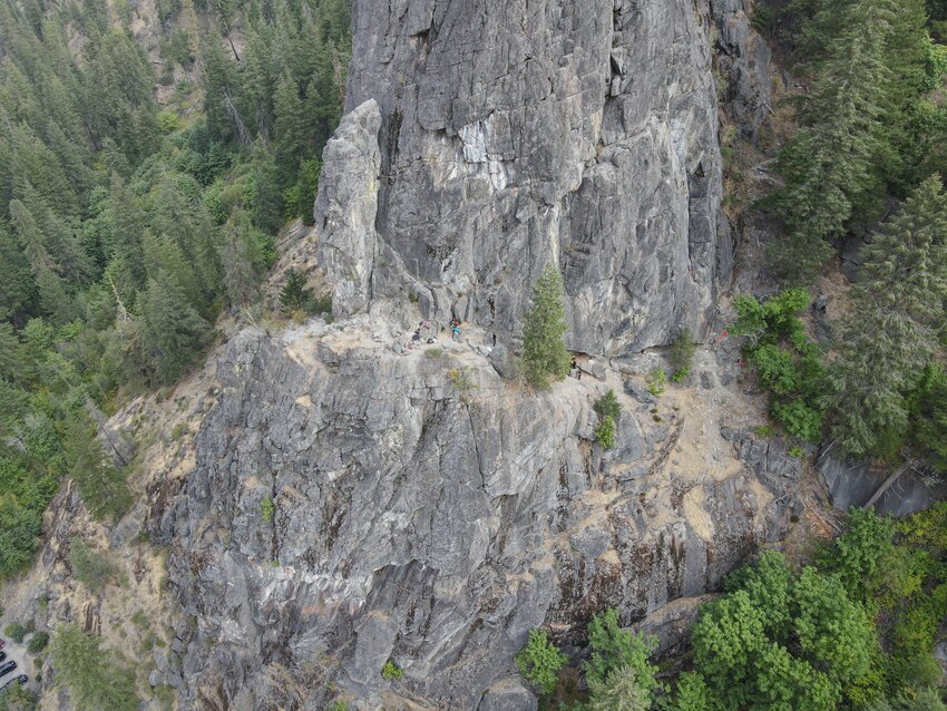 Members of the Wenatchee Valley Fire Rope Rescue team carefully navigate the steep terrain of Castlerock in Tumwater Canyon as they transport an injured 43-year-old female climber to safety. The climber fell approximately 25 feet on the Saber Route, prompting a complex rescue operation involving multiple agencies on September 6, 2024.