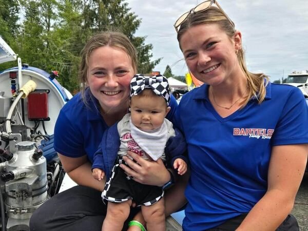 Marissa, left, and Marina Bartels pose with Kennedy Fanaris, daughter of a fellow boat driver.