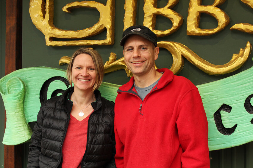 Rusty and Amanda Gibbs, owners of Gibbs Graphics, celebrate 20 years of shaping Leavenworth's iconic signs and murals. The couple started the business after moving back to Rusty's hometown of Leavenworth and have since become integral to the town's Bavarian aesthetic.