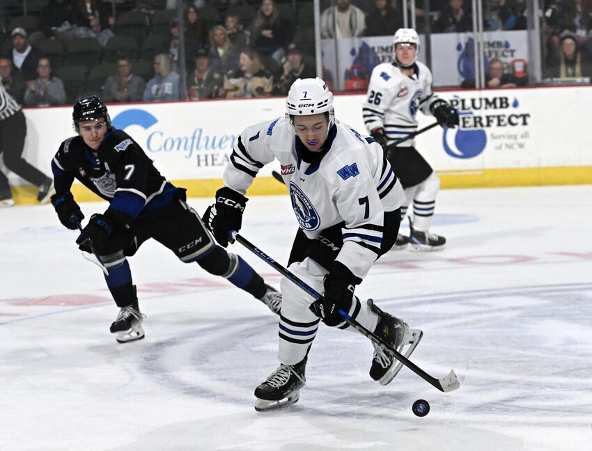 Wenatchee Wild defenseman Brayden Pankey tries to settle the bouncing puck Saturday in a 3-0 Western Hockey League defeat against the Victoria Royals.