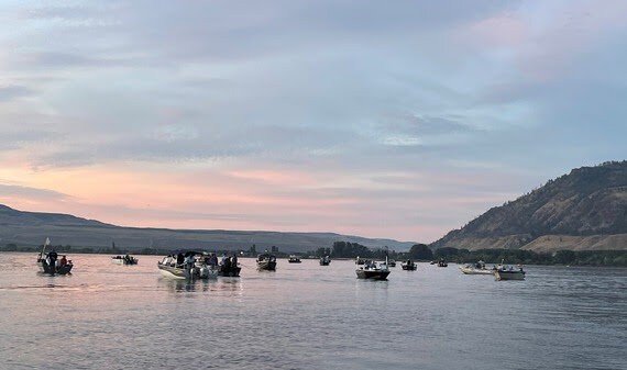 Boats congregate at Brewster Pool on the Upper Columbia River to try their luck at catching sockeye salmon. Photo credit: Mark Yuasa
