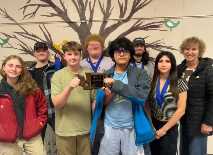 The Pateros Knowledge Team holds the regional trophy as the team prepares to compete at Washington State Tournament in Wenatchee on March 22.