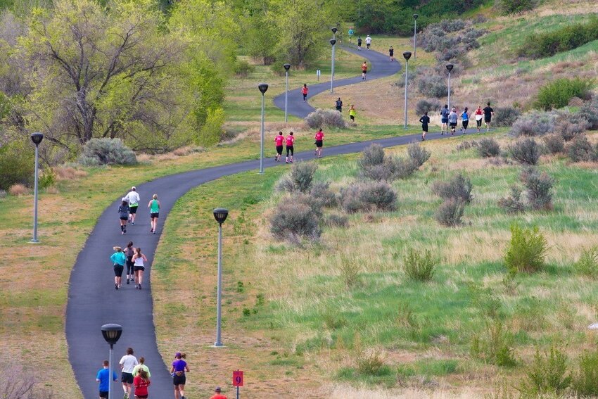 Participants run along the Apple Capital Loop Trail during the Wenatchee Marathon.