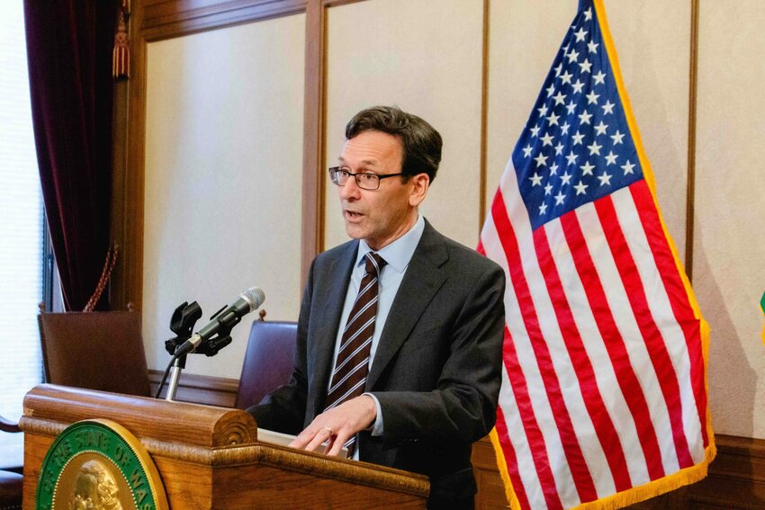 Gov. Bob Ferguson speaks to reporters about the budget on Tuesday, April 1, 2025.