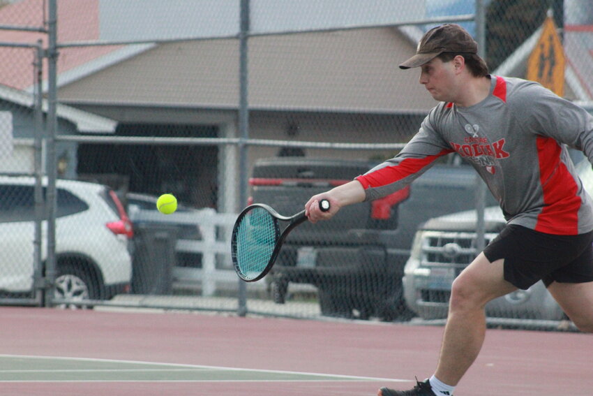Adan Vargas delivers a shot against a Cashmere doubles team last April 7. Vargas and Melvin Northrup lost in two sets.