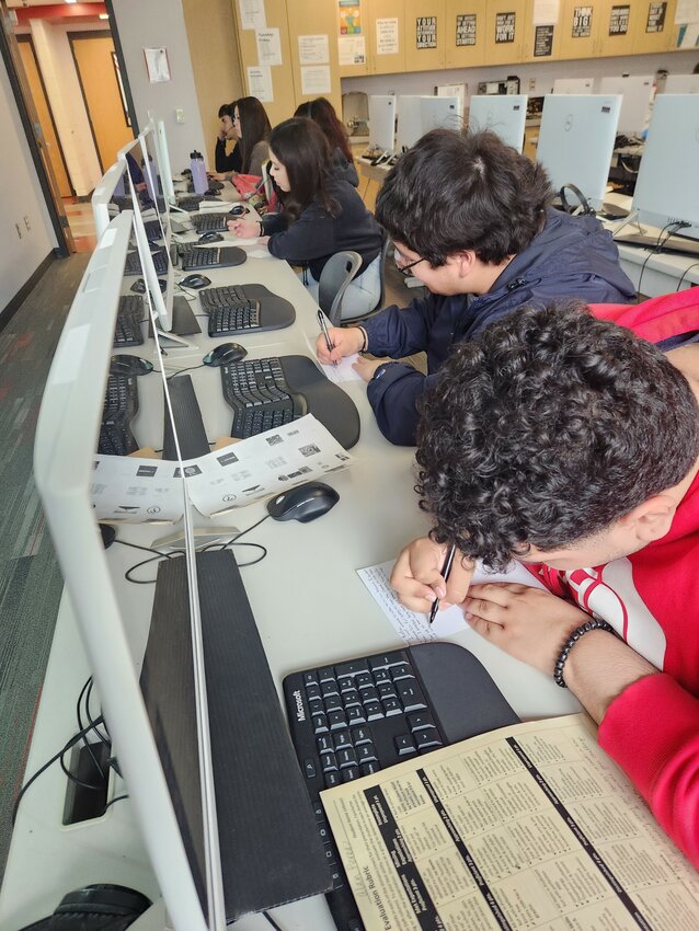 Brewster High School seniors in Financial Literacy class take a break from learning about money to write thank-you cards to their job shadow mentors. 