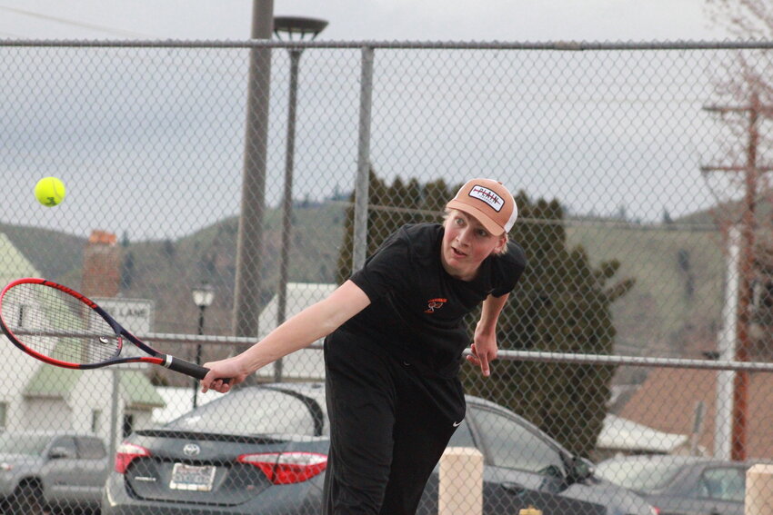 Quentin Christensen delivers a backhand during his doubles team’s match against Cascade on
April 7. The duo of Christensen and Kamren Meloy defeated its Kodiak counterparts Melvin Northrup and Adan Vargas, 6-3, 6-0.