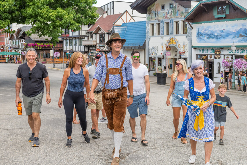 Bavarian Walking Tours co-owners and guides Tom Potter and Coco Hopkins lead a group down Front Street.