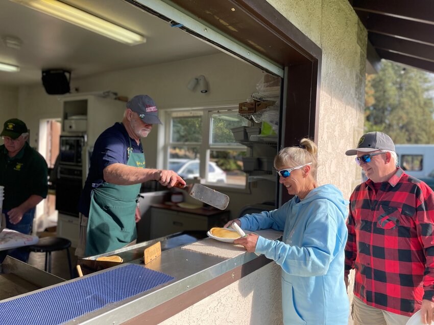 Leavenworth Lion Dave Wilkie serves fresh pancakes during the last pancake breakfast of 2024.