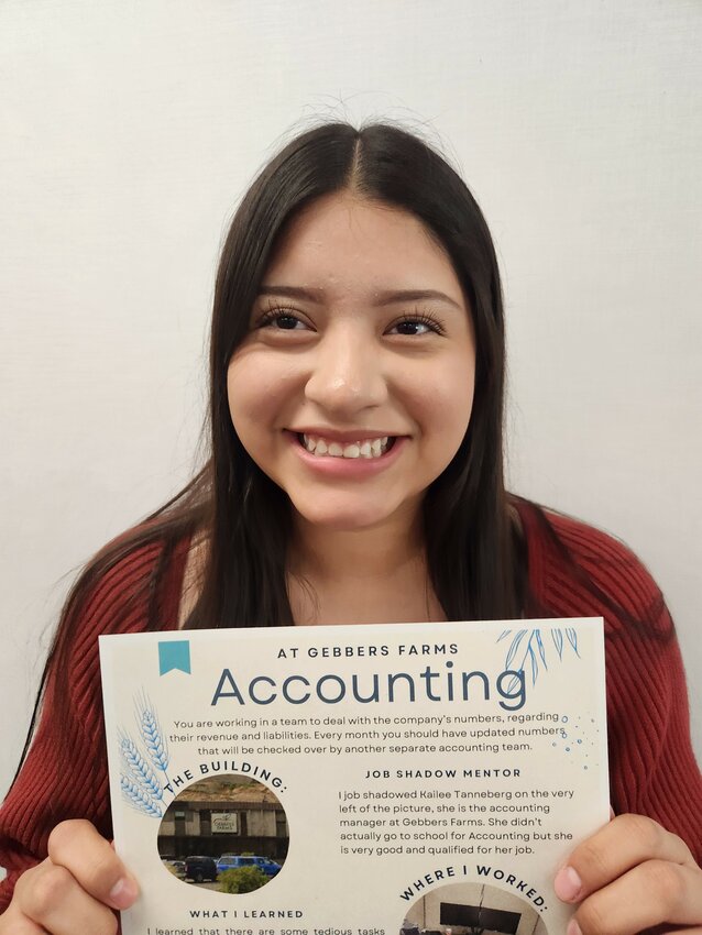 Mareli Arevalo-Martinez, a senior at Brewster High School, displays a summary of her job shadow experience in the accounting department at Gebbers Farms. Her 20-hour internship helped confirm her plans to pursue a degree in accounting and become a CPA.