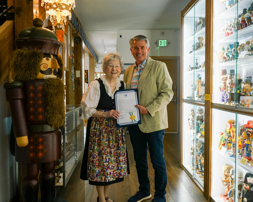 Sen. Keith Goehner posing with Arlene Wagner as she receives the Senate resolution he sponsored in honor of her 100th birthday.