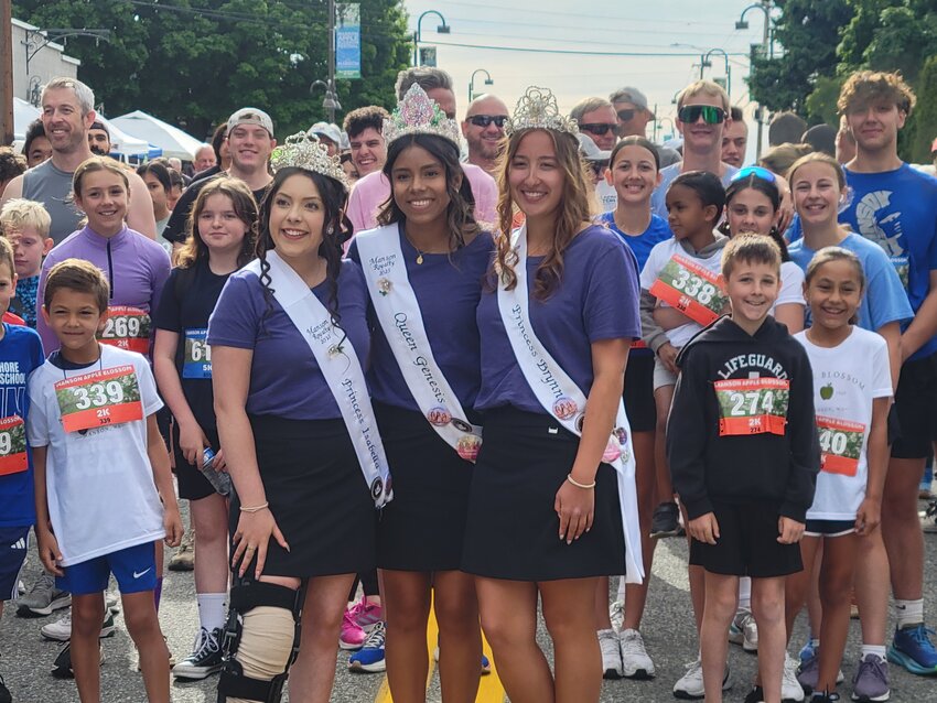 The Manson Apple Blossom royalty took time out of their busy schedule on Saturday morning, May 10, before the grand parade, to pose for a photo with the 220 walkers and runners in the fun run. Left to right are: Princess Isabella Alexander, Queen Genesis Torres and Princess Brynn Williams.