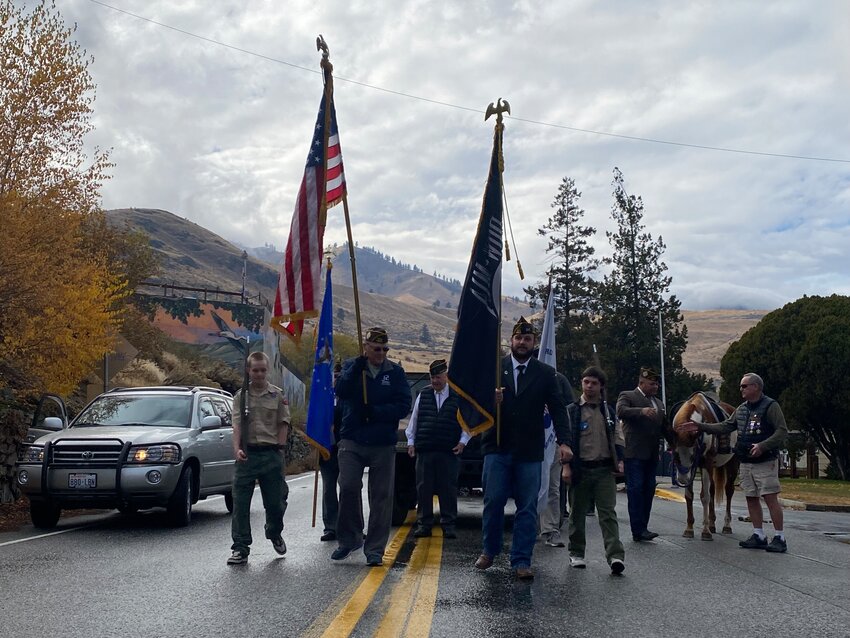 Members of the Veterans of Foreign Wars Post 6853 and Boy Scouts Troop 34 march in the 2024 Memorial Day Parade.