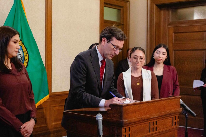 Gov. Bob Ferguson signed a trio of bills on Monday related to protecting immigrants in Washington state.