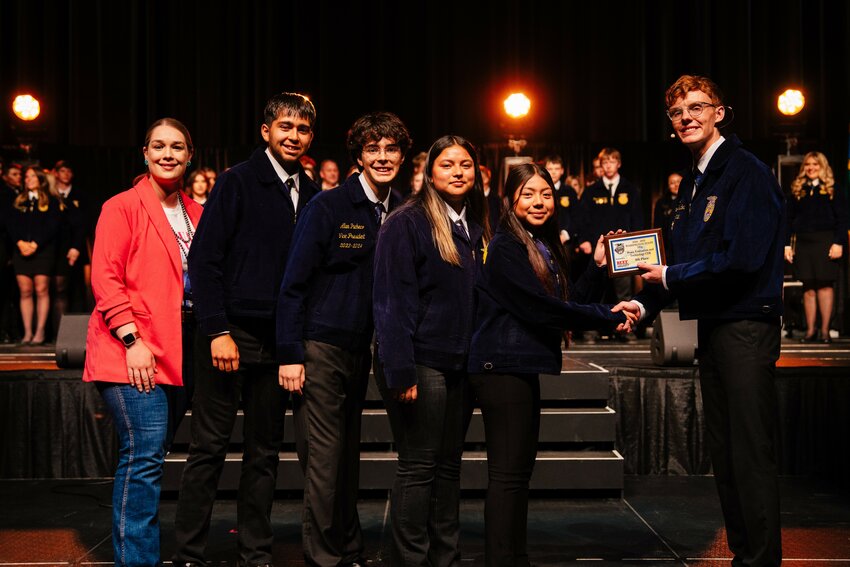 FFA advisor Natasha Hemmer, left, and the Meat Science Team of Rafael Cruz, Alan Pacheco, Kayla Sanchez, and Alexa Maceda accept the eighth-place award.