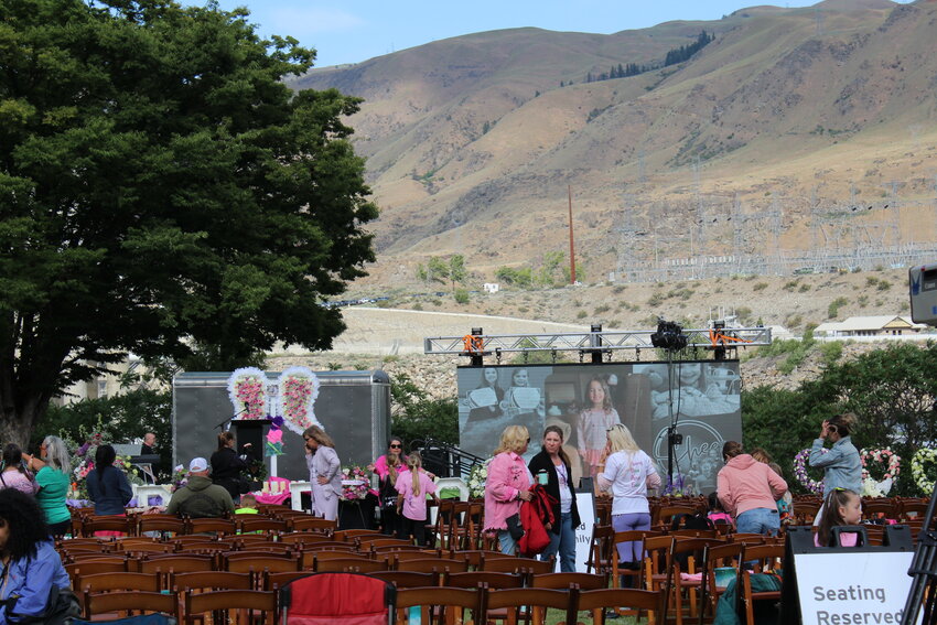 Mourners and program participants gather before the memorial in the shadow of Rocky Reach Dam.