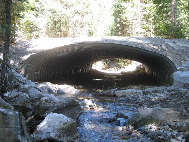 The is an example of one of the newer style of bottomless arch culverts that allows fish and other aquatic organisms passage under a road. This one is located along the Alder Creek Road #6208 on the Wenatchee Johnson, Wenatchee River Ranger District Fisheries Biologist
Photo by McLain Johnson, Wenatchee River Ranger District Fisheries Biologist, USDA Forest Service.