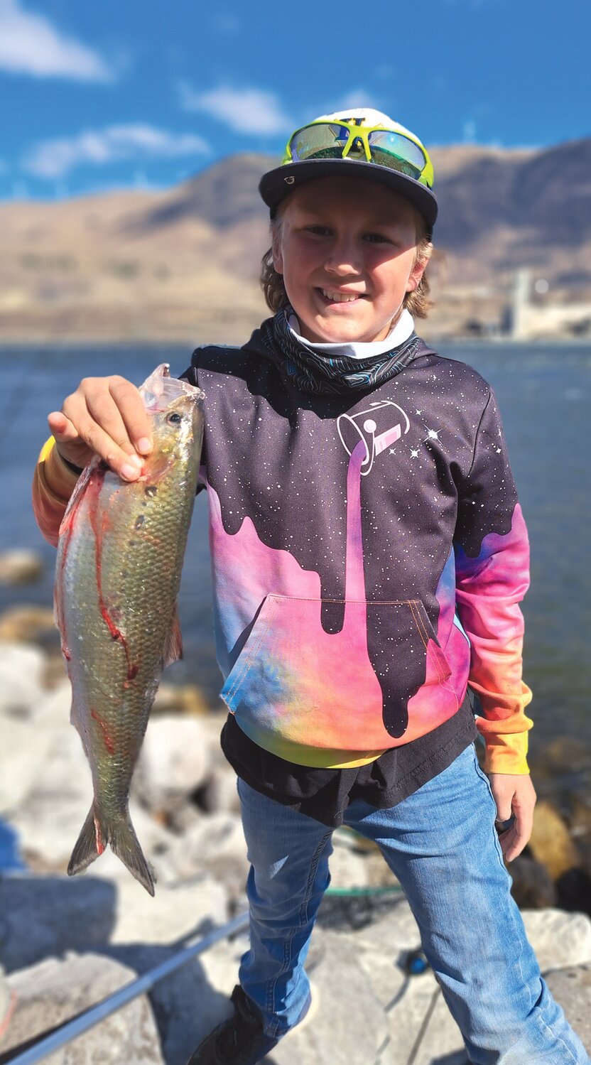 Nine-year old Will Clarke with one of several shad he caught near the John Day Dam.
Courtesy John Kruse