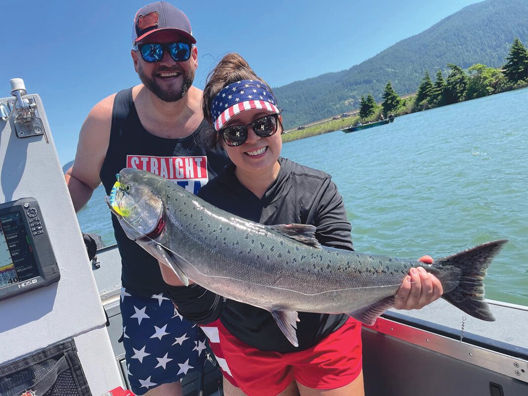 Jarod Higginbotham and Kiana Wilson with a spring Chinook caught out of the Columbia River. – Courtesy Jarod Higginbotham