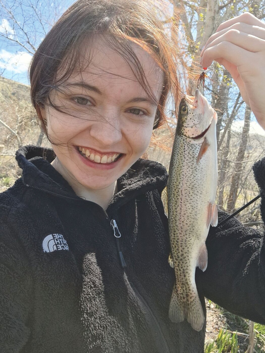 Faith Kruse with a lowland lakes opener trout caught in Kittitas County.
Courtesy Faith Kruse