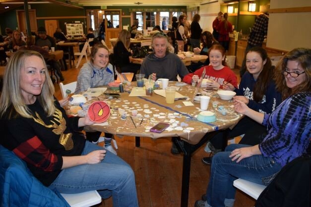 The four members of the  Swoboda family on the right and friends get creative at a past Upper Valley Empty Bowls Glazing Days event.
Submitted Photo