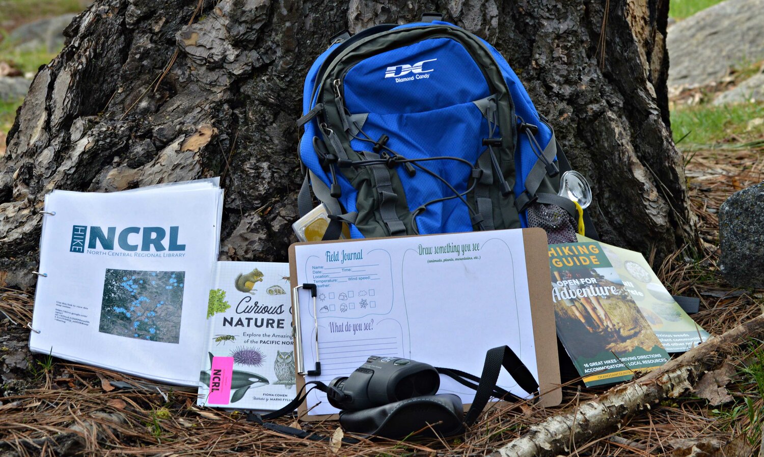 The nature backpacks available at the NCRL have several tools and guides to aid patrons on their outdoor journey. Photo illustration by Al Stover