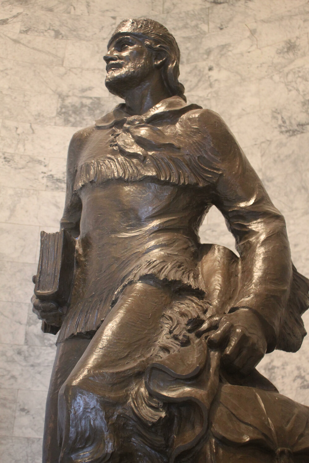 Statue of Marcus Whitman stands in the front lobby of Washington State’s capitol building. An exact replica exists in National Statuary Hall in Washington, D.C. Democrats have proposed to remove the statues and replace them with a different honoree. -- Photo by Emma Scher, WNPA Olympia News Bureau